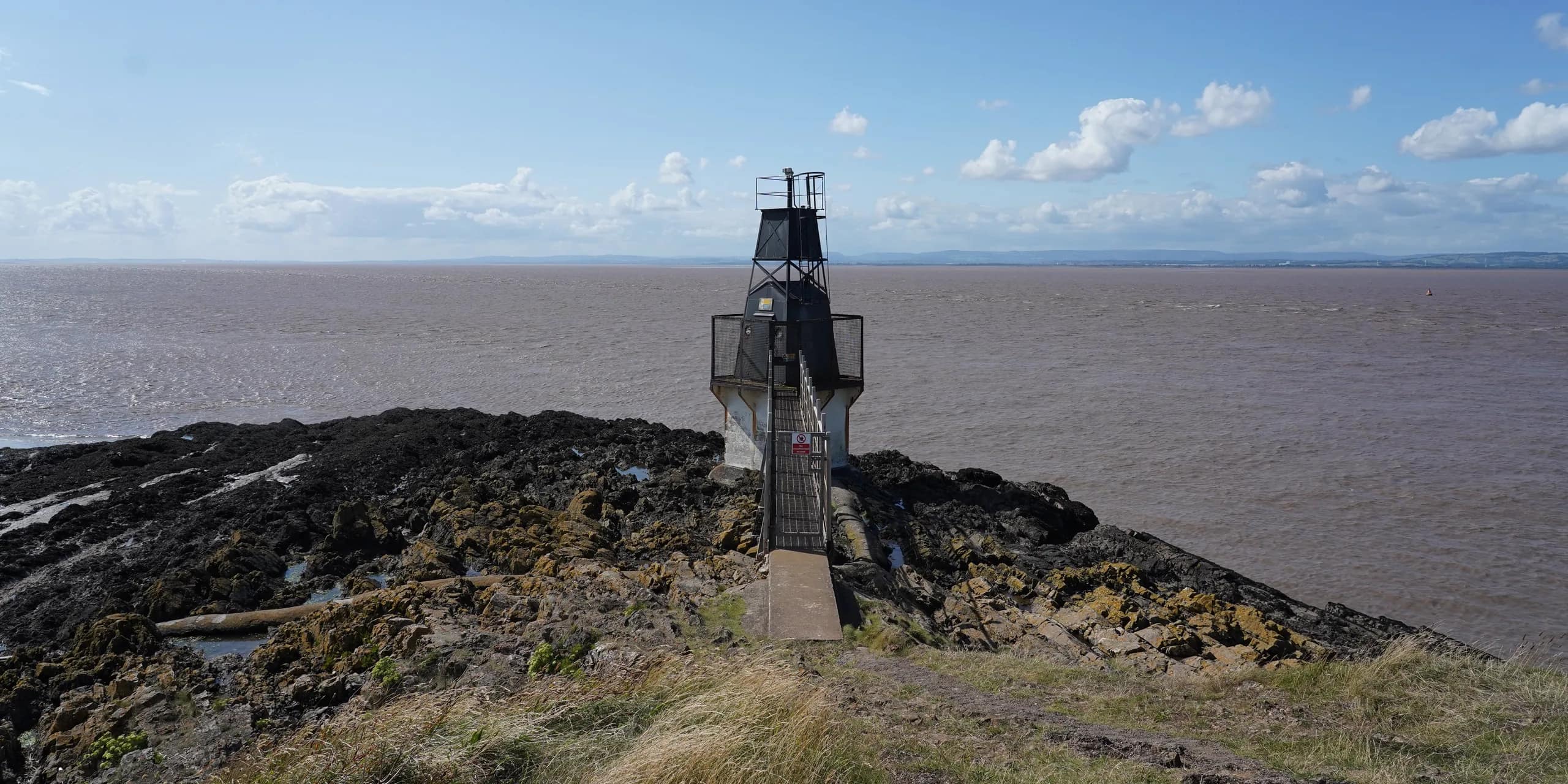 Battery Point Lighthouse on the rocky shore at Portishead