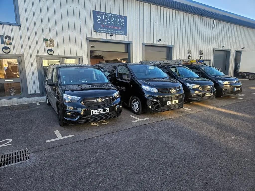 Four Somerset Window Cleaning vans parked outside the unit at Rockhaven Business Centre in Street