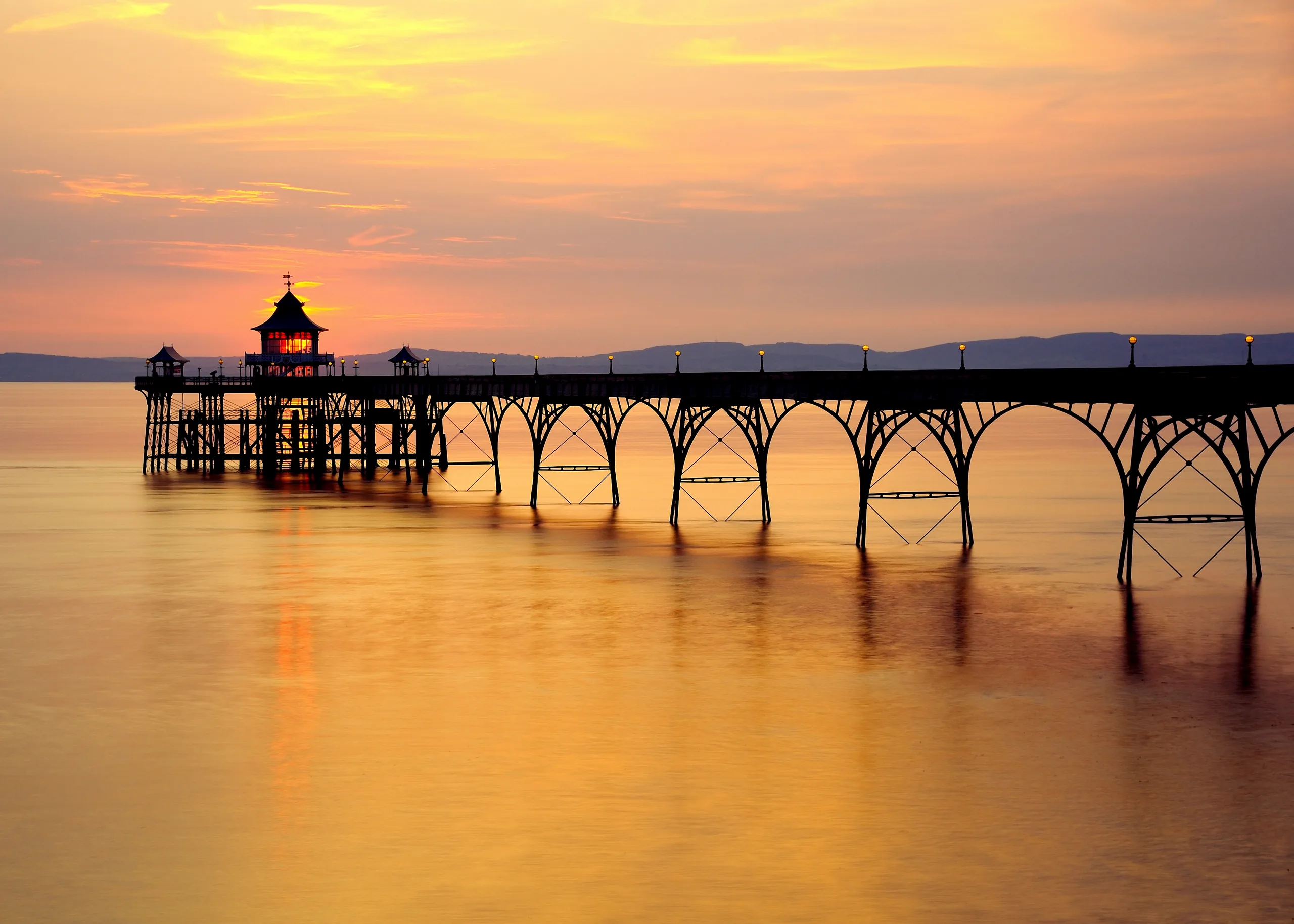 Clevedon Pier silhouetted against a golden sunset over the Severn Estuary