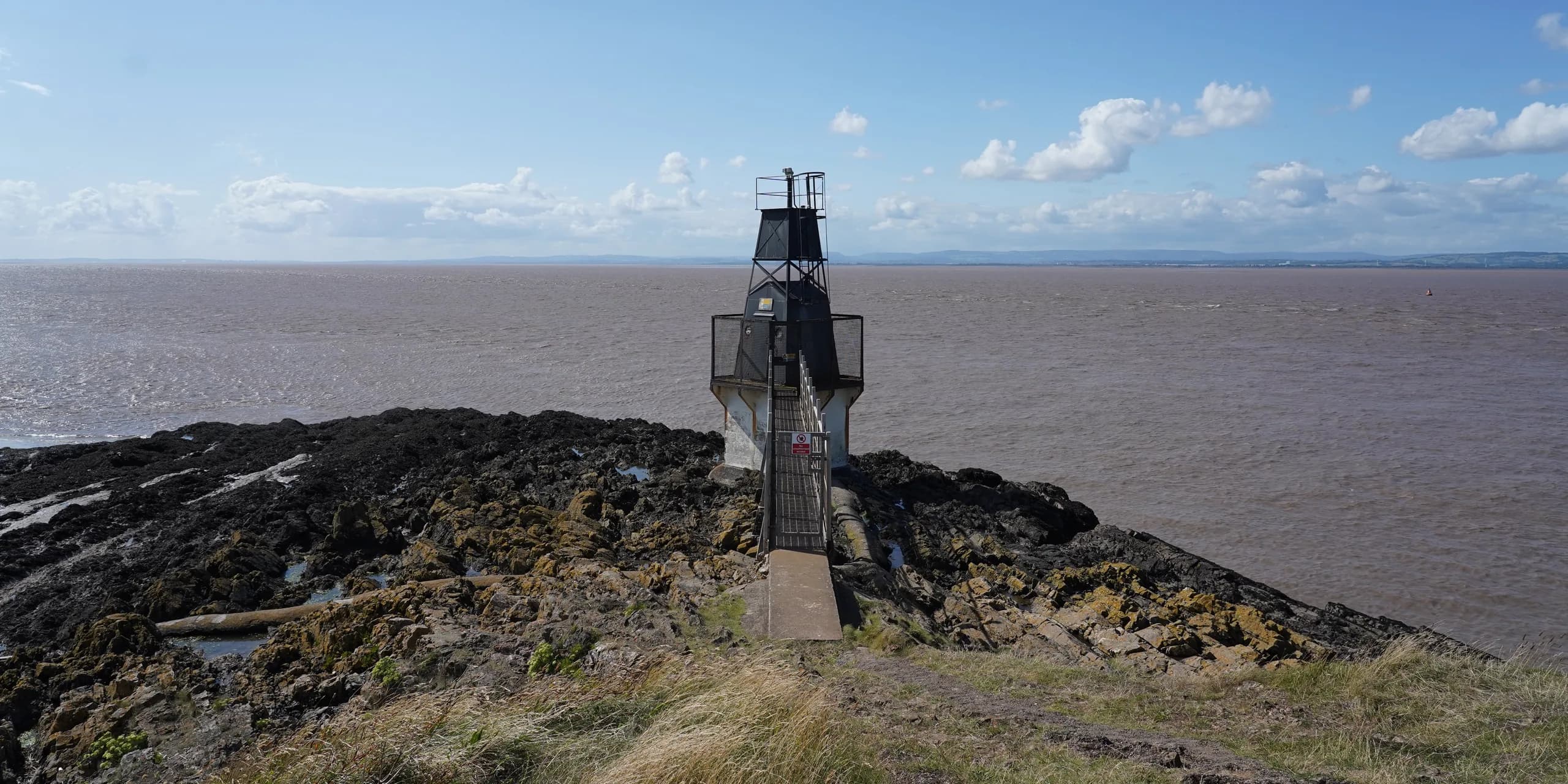 Battery Point Lighthouse on the rocky shore at Portishead