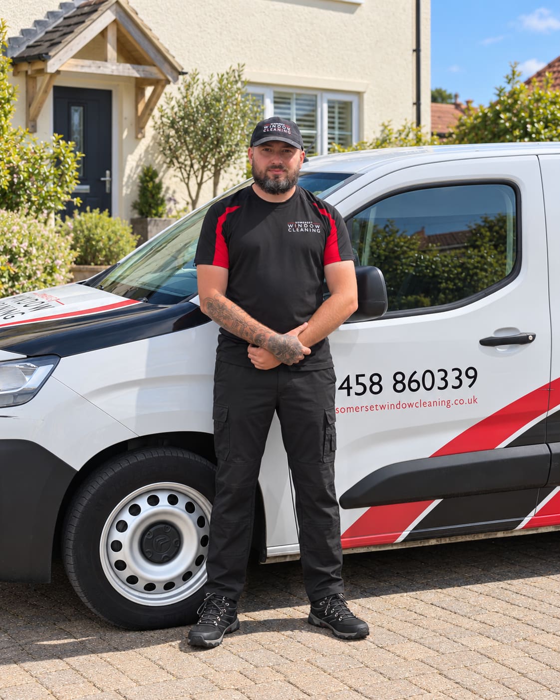 Luke, Window Cleaner at Somerset Window Cleaning; portrait with an edited van background