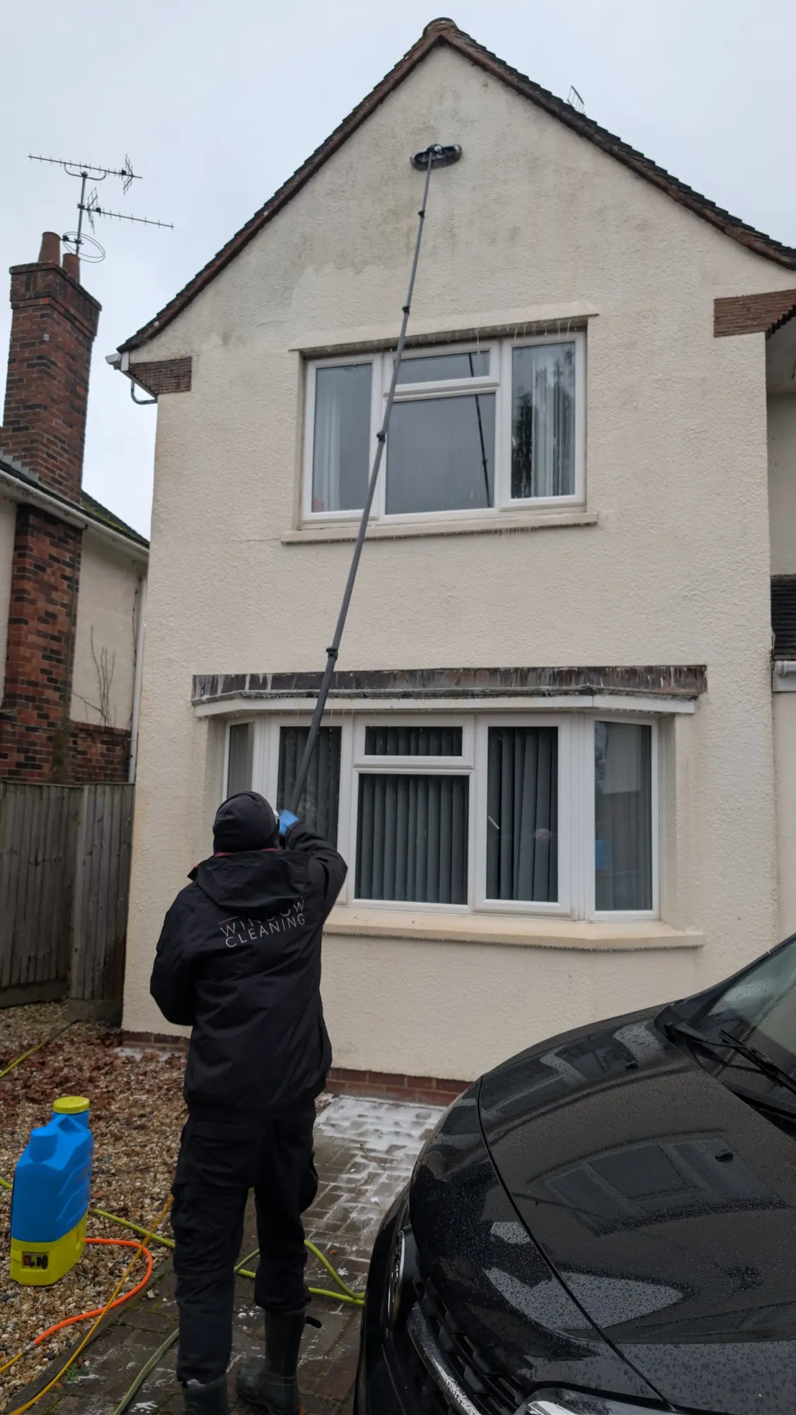 Rendered walls being soft washed on a Somerset property
