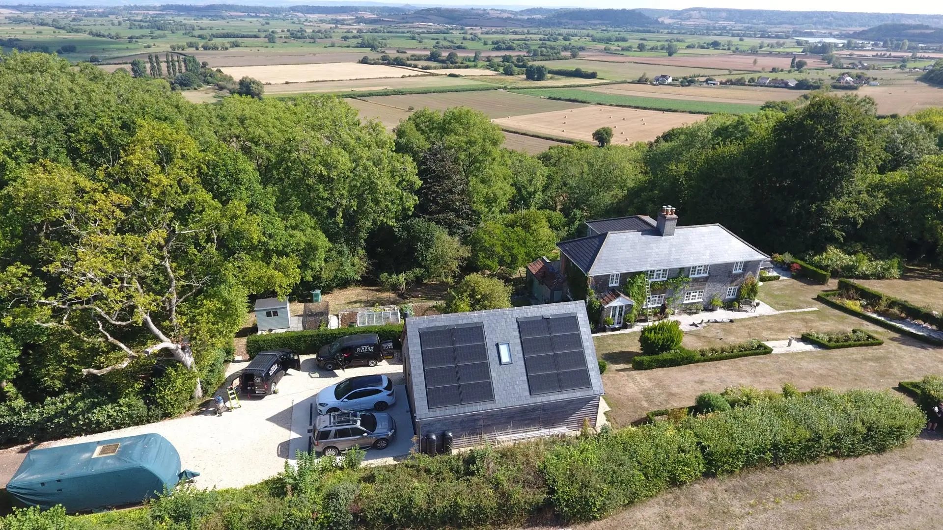 Window cleaner working on conservatory roof cleaning