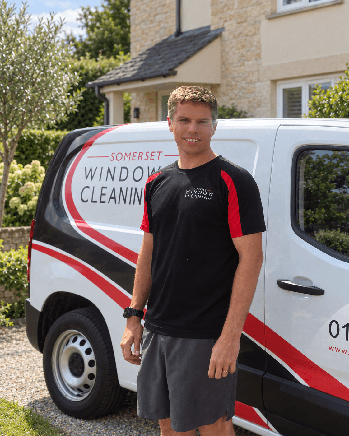 Dan Lee, owner and founder of Somerset Window Cleaning; portrait with an edited van background